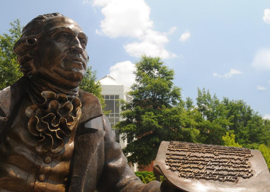 Alt text: Statue of George Mason in Wilkins Plaza