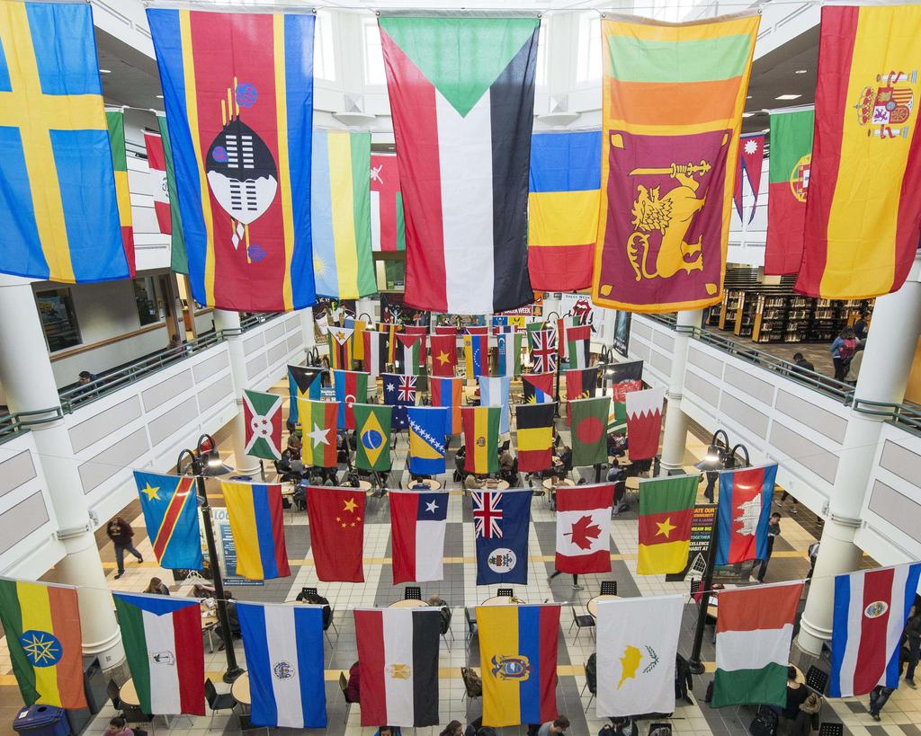 The colorful flags of different countries hang from the ceiling of the Johnson Center.