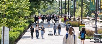 Students walk through Wilkens Plaza on Mason's Fairfax Campus.